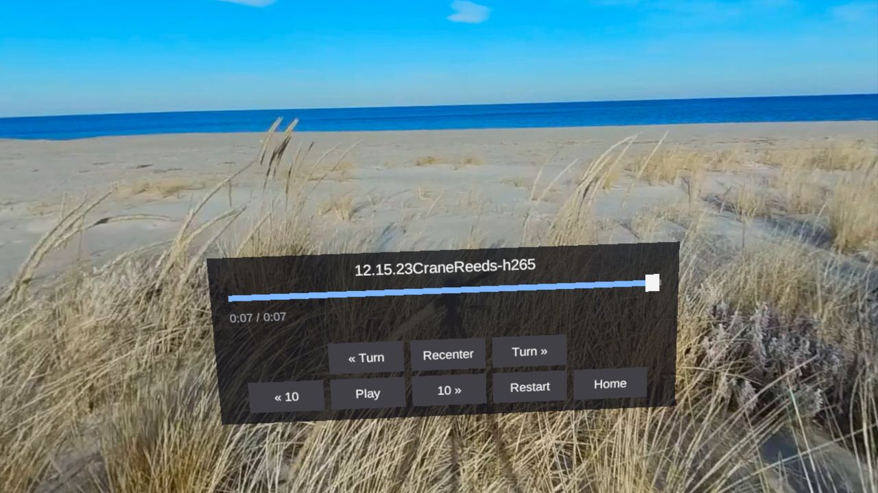 A 360 lesson playing in the headset, showing dune grass and open water, with the playback panel in view